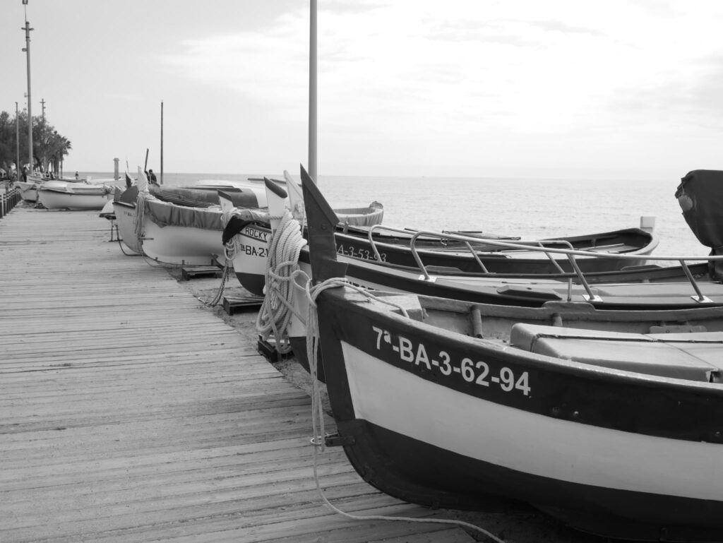 Fishing boats moored along the pier, waiting for another early morning departure.